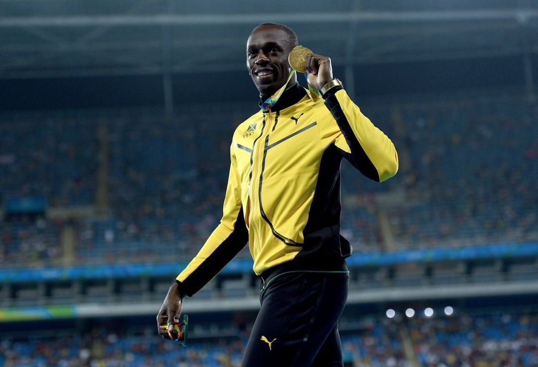 Usain Bolt with gold medal